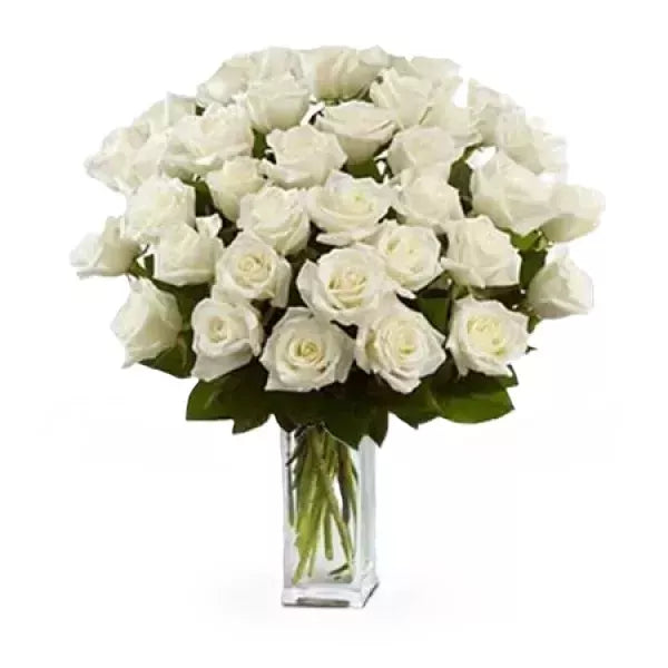 White roses bouquet in a glass vase