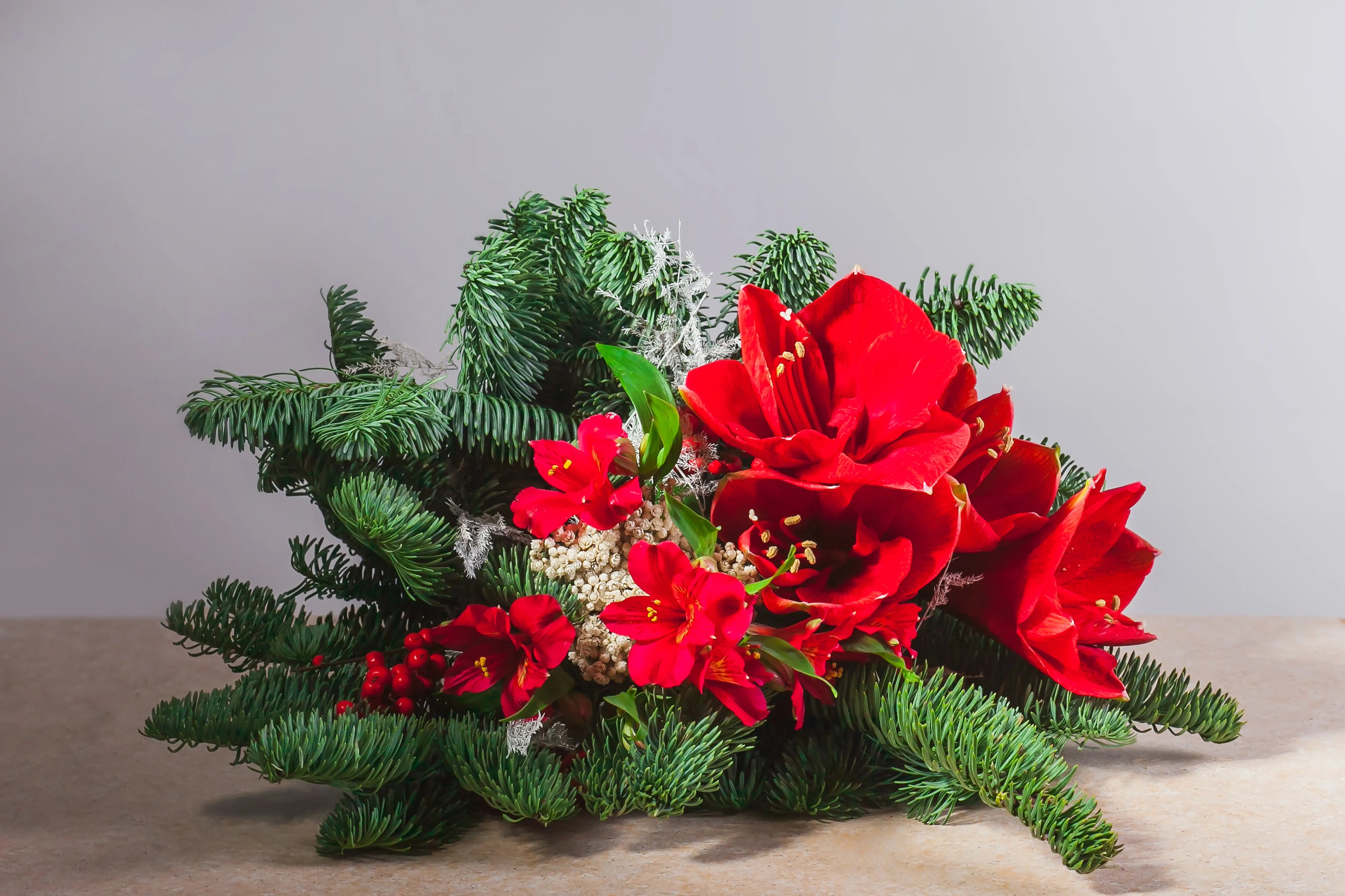 Christmas floral arrangement with red flowers